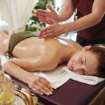 smiling-woman-enjoying-massage-in-spa.jpg